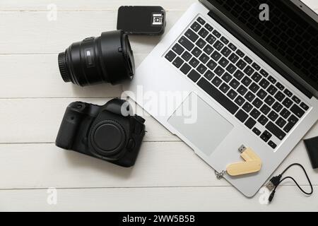 Composition with modern gadgets on light wooden background Stock Photo