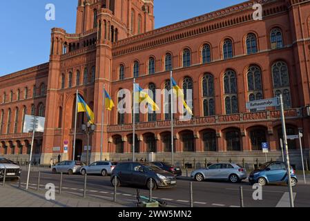 a row of Ukrainian flags  flying outside Rotes Rathaus, the town hall of Berlin, Germany, March 2024 Stock Photo
