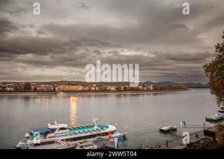 Picture of a panorama of Bonn Skyline with a focus on the Rhine river and cruise ships in front, ready for a cruise on the rhine river. The federal ci Stock Photo