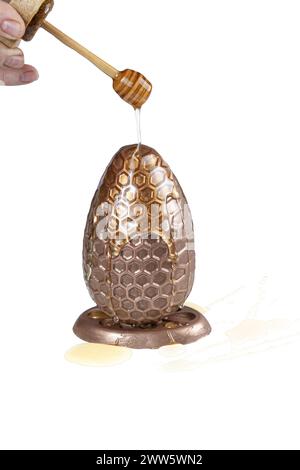 Milk chocolate Easter egg filled with Brazilian honey cake 3.jpg Stock Photo