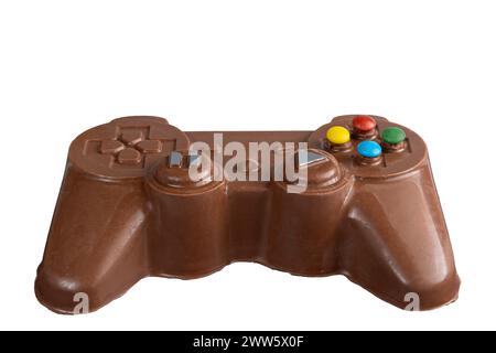 Milk chocolate in the shape of a video game controller alongside small rabbits 1.jpg Stock Photo