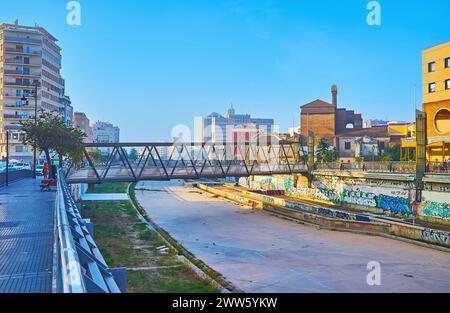 The modern Trinidad Bridge (Puente de La Trinidad) across dried up Guadalmedina River in Malaga, Spain Stock Photo