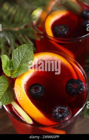 Aromatic Christmas Sangria drink in glasses on table, closeup Stock Photo