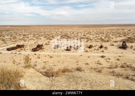 Rusty abandoned ships at the Ship cemetery at the former Aral sea coast in Moynaq (Mo ynoq or Muynak), Uzbekistan Stock Photo