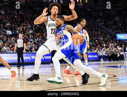 Milwaukee, USA. 21st Mar, 2024. Milwaukee Bucks guard Damian Lillard (R, front) dribbles during the NBA regular season game between Milwaukee Bucks and Brooklyn Nets in Milwaukee, the United States, March 21, 2024. Credit: Joel Lerner/Xinhua/Alamy Live News Stock Photo