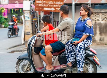 Mae Hong Son province,Northern Thailand-April 10 2023:A strange sight to see,perhaps,in Western countries.But in Asia the motorcycle is a popular way Stock Photo