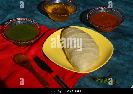 Himachal Pradesh special dish Siddu. It is a steamed wheat flour bread stuffed with split black gram lentils, dry fruits, poppy seeds, walnut etc. Stock Photo