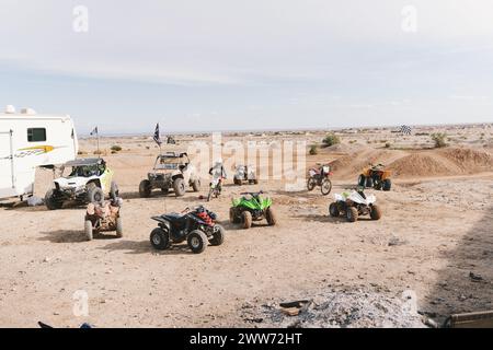 Group of ATV vehicles and dirt bikes in the desert. Stock Photo