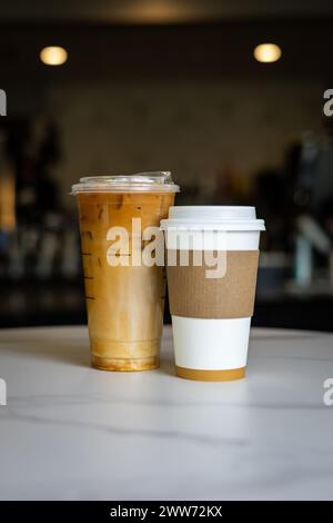 Two cups of coffee on white table, side by side Stock Photo
