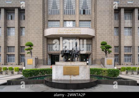 Landscape view of the facade and entrance of ancient General Post Office aka Grand Postal Building with statue of Prince Bhanurangsi Stock Photo