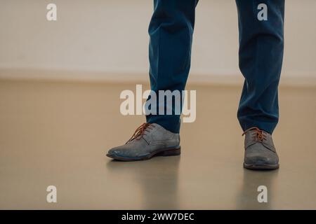 Start Concept. Low Section of Businessman Steps into Start Line and Moving Forward to New Challenge. Cropped Image. Side View. Business Strategy Stock Photo