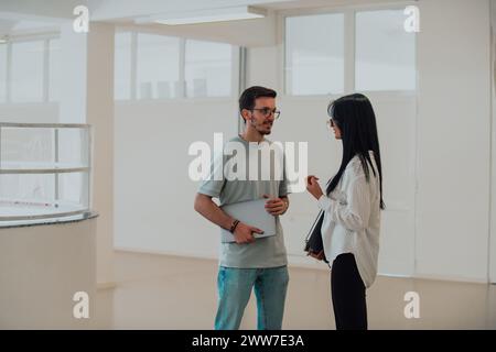 Students Collaborate on a Project in College Library Stock Photo