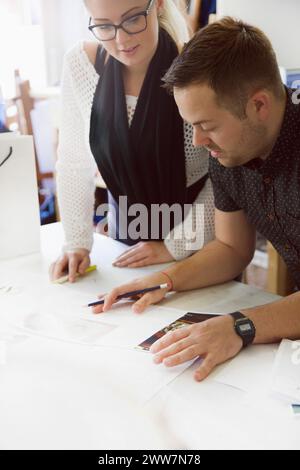 Design Professionals Working at Embroidery Studio Stock Photo