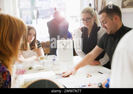Design Professionals Working at Embroidery Studio Stock Photo