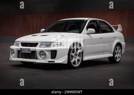 Bilbao, Spain-November 11, 2023: Mitsubishi Lancer Evolution V (Evo) in indoor parking Stock Photo