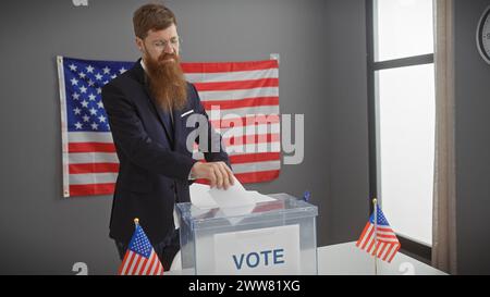 Redhead bearded man in suit voting at an american election with usa flags in the background. Stock Photo