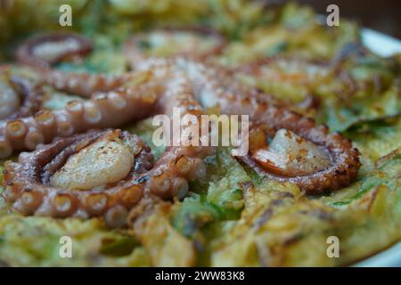 Korean-style pancakes with whole octopus and green onion Stock Photo