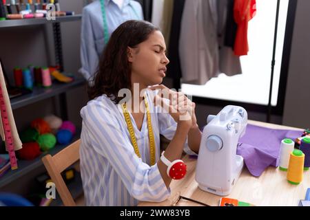 Young african american woman florist smiling confident holding plant at atelier Stock Photo