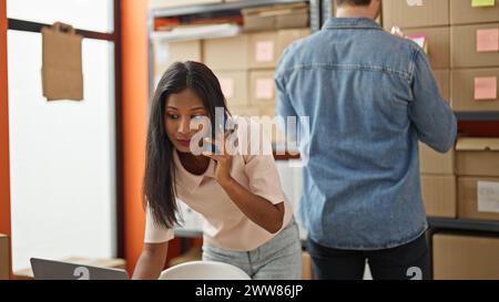 Two workers man and woman working together at office Stock Photo