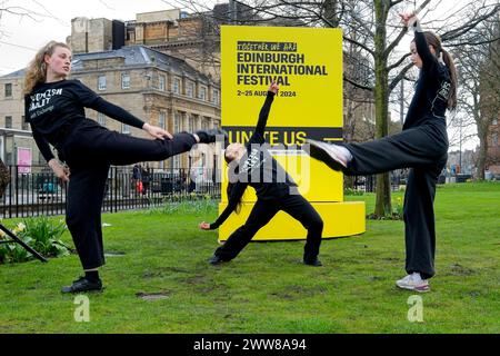 Edinburgh, Scotland. Friday 22nd, March, 2024. This week tickets to the Edinburgh International Festival go on sale to the public. To mark the occasion, St Andrew Square sees young Scottish Ballet dancers performing with a giant version of this years brochure which are on display in various key Edinburgh locations. For the next three days a different artist will perform inside the brochure. Credit: Brian Anderson Stock Photo