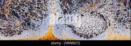 Fluid soap bubble psychedelic colorful abstract art. Surreal patterns with rainbows and waves of color in motion. Stock Photo