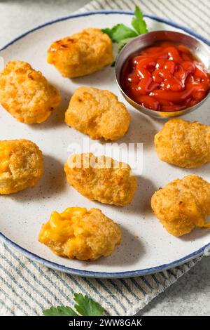 Deep Fried Macaroni and Cheese Bites with Ketchup for Dipping Stock Photo