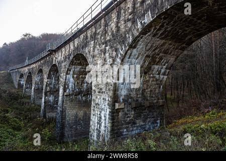 Old stone arched bridge-viaduct, Ternopil region, Ukraine. Stock Photo