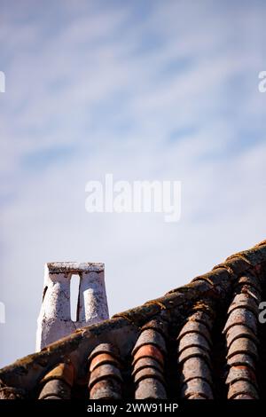White chimney on traditional roof in Alhambra Stock Photo