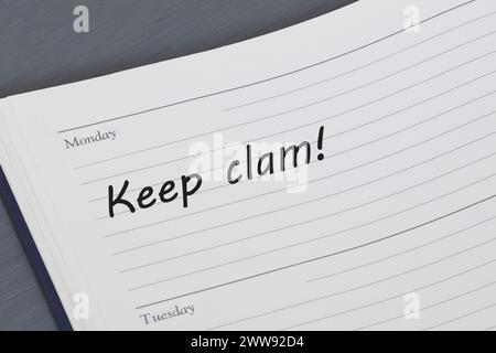 Keep calm reminder message in an open diary Stock Photo