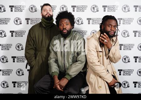 Young Fathers backstage before their performance at the Royal Albert Hall in London as part of the Teenage Cancer Trust show. Picture date: Friday March 22, 2024. Stock Photo