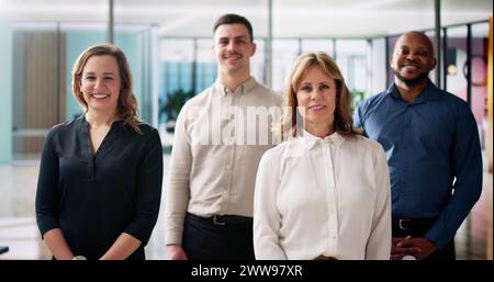 Happy Group Of Business People Standing In Office Stock Photo