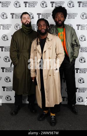 Young Fathers backstage before their performance at the Royal Albert Hall in London as part of the Teenage Cancer Trust show. Picture date: Friday March 22, 2024. Stock Photo