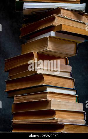 A stack of old books and notebooks on the table Stock Photo