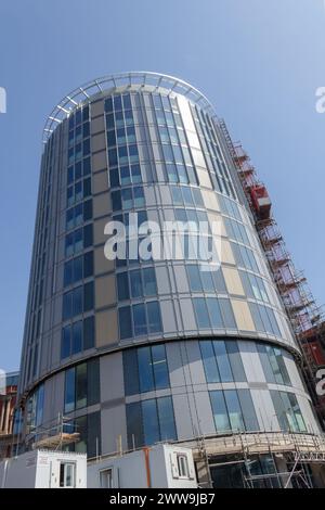 Rotunda Lift construction of a building: a hoist with the scaffolding and part of a ...