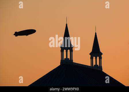 blimp flies over twin spires are used as a symbol of Churchill Downs and the Kentucky Derby - Louisville, Kentucky - USA Stock Photo
