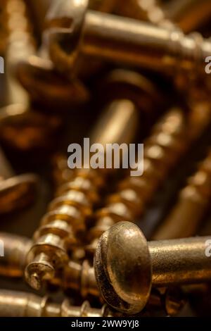 close up of many brass colored screws Stock Photo