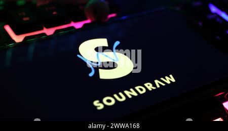 Viersen, Germany - March 9. 2024: Closeup of Smartphone with logo lettering of AI music generator Soundraw on computer keyboard Stock Photo