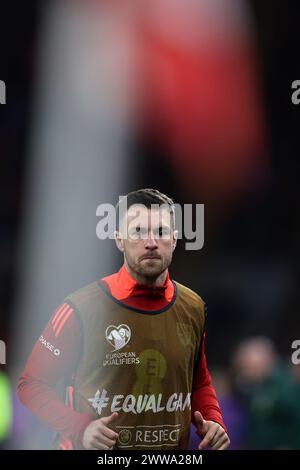 Cardiff, UK. 21st Mar, 2024. Aaron Ramsey of Wales warms up as a substitute during the game.Wales v Finland, UEFA Euro 2024 qualifying, play off match at the Cardiff city stadium in Cardiff, South Wales on Thursday 21st March 2024. Editorial use only. pic by Andrew Orchard/Andrew Orchard sports photography/Alamy Live News Credit: Andrew Orchard sports photography/Alamy Live News Stock Photo