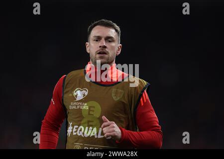 Cardiff, UK. 21st Mar, 2024. Aaron Ramsey of Wales warms up as a substitute during the game.Wales v Finland, UEFA Euro 2024 qualifying, play off match at the Cardiff city stadium in Cardiff, South Wales on Thursday 21st March 2024. Editorial use only. pic by Andrew Orchard/Andrew Orchard sports photography/Alamy Live News Credit: Andrew Orchard sports photography/Alamy Live News Stock Photo