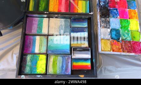 Vibrant Face Paint Palettes Ready for Artistic Creations Stock Photo
