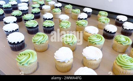 Assorted Cupcakes with Swirled Frosting on Display Stock Photo