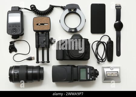 Composition with different modern gadgets on light background Stock Photo