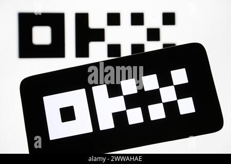 Kyiv, Ukraine. 22nd Mar, 2024. In this photo illustration, OKX Crypto Exchange logo is seen on a smartphone and a pc screen. Credit: SOPA Images Limited/Alamy Live News Stock Photo