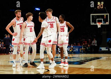 Brooklyn, NY, USA. 22nd Mar, 2024. Wisconsin Badgers forward Tyler Wahl (5), guard Max Klesmit (11), guard Chucky Hepburn (23), forward Nolan Winter (31), and guard John Blackwell (25) during the NCAA Men's March Madness Round One Tournament basketball game between the James Madison Dukes and the Wisconsin Badgers at the Barclays Center in Brooklyn, NY. Darren Lee/CSM/Alamy Live News Stock Photo