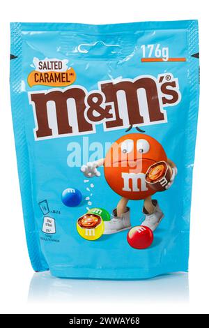 Stuttgart, Germany - May 19, 2023: M&M's salted caramel type chocolate confectionery by Mars Inc. company isolated on white in Stuttgart, Germany. Stock Photo