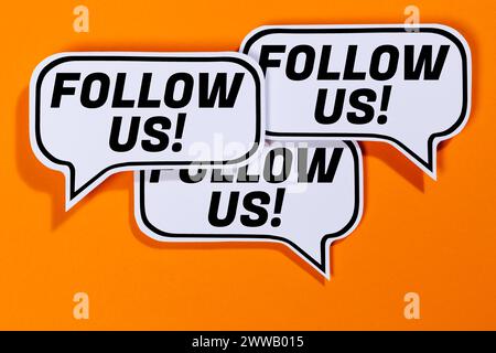 Follow us follower followers fans likes social networking media internet in speech bubbles communication business concept orange Stock Photo