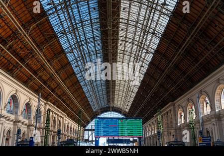 Budapest, Hungary - January 28, 2024: Keleti train station. Information table on the foreground. Stock Photo