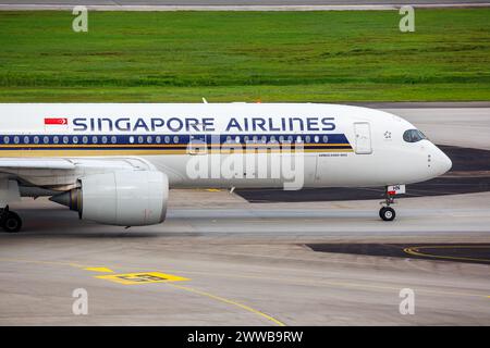 Changi, Singapore - February 3, 2023: Singapore Airlines Airbus A350-900 airplane at Changi Airport (SIN) in Singapore. Stock Photo
