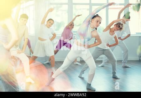 Group of children warming up before dance class Stock Photo