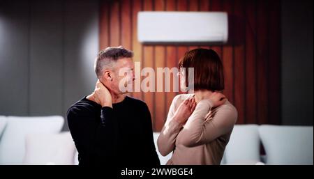 Sick Couple Having Cold And Sore Throat From Air Conditioner Stock Photo